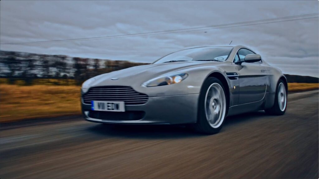 aston martin on road running from front left angle a quatre. – Lumira Studio