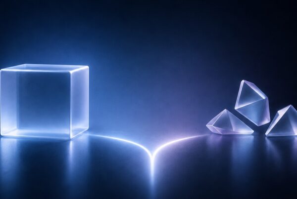 Neon blue translucent cube on the left connected by a glowing line to three glass-like prisms on the right in a dark studio setting. – Lumira Studio