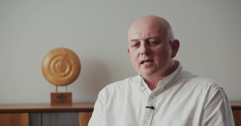 Talking head video interview setup Timber Connection Peter Clayton of Timber Connection speaking to camera in a talking head interview, framed chest up with a lapel microphone